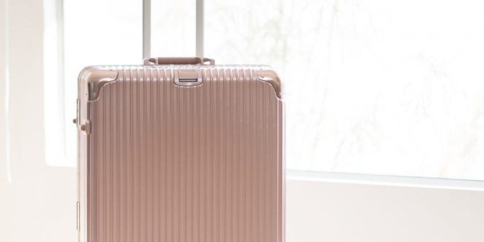 pink luggage and bag and hat for travel
