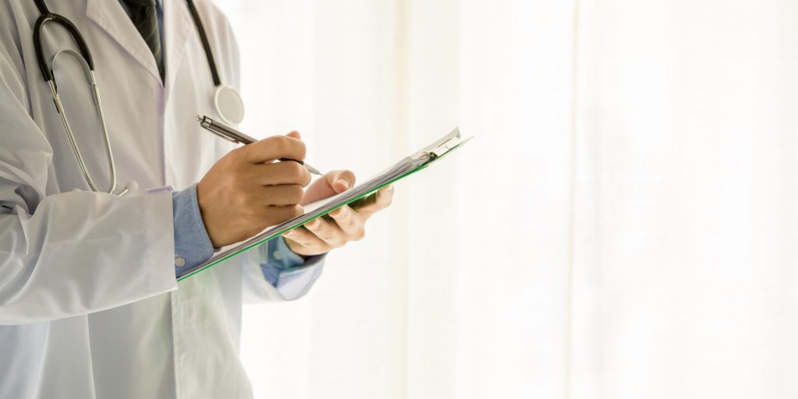 Medical physician doctor man over white background.