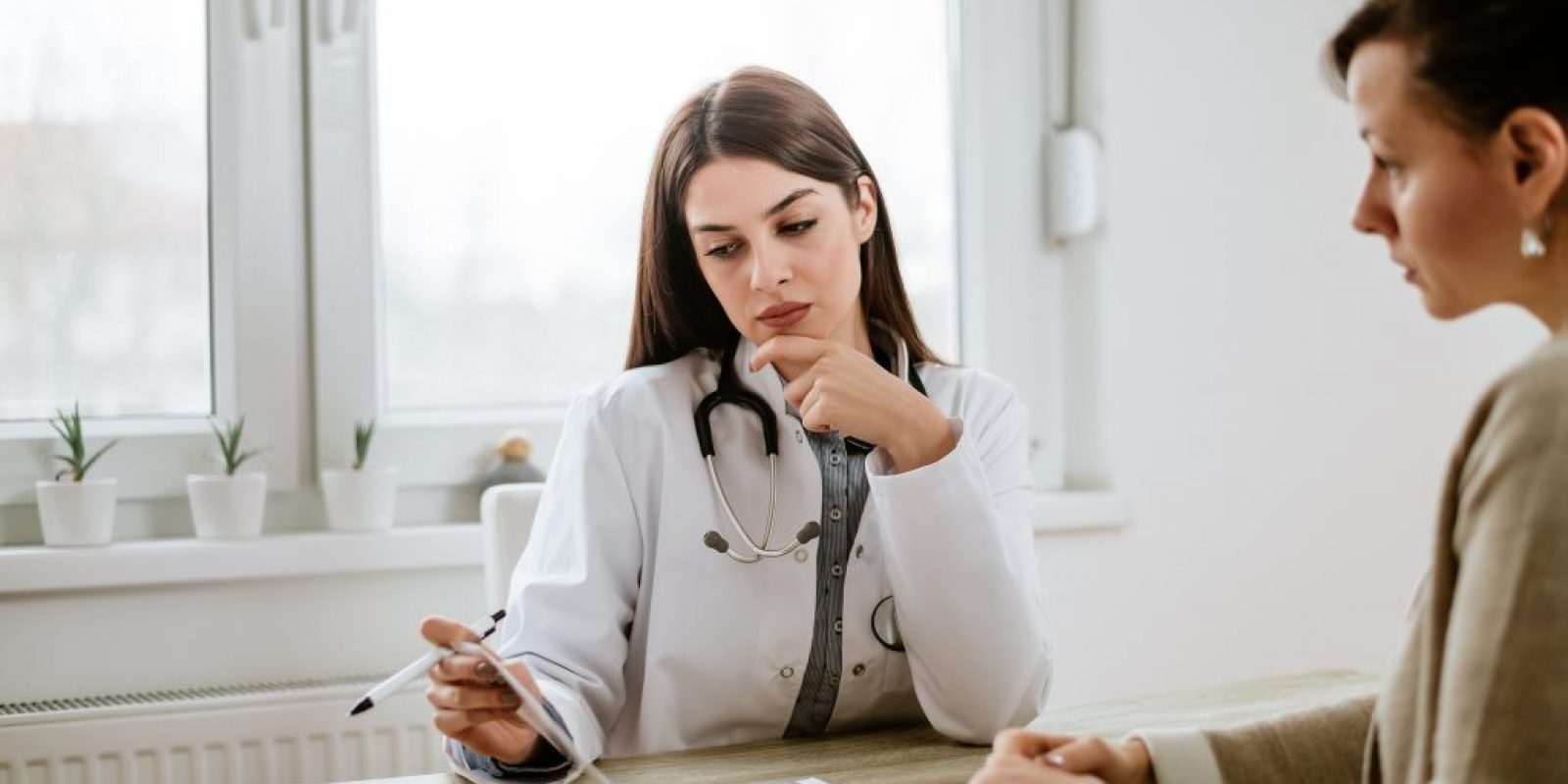 Serious doctor discussing test results with patient.