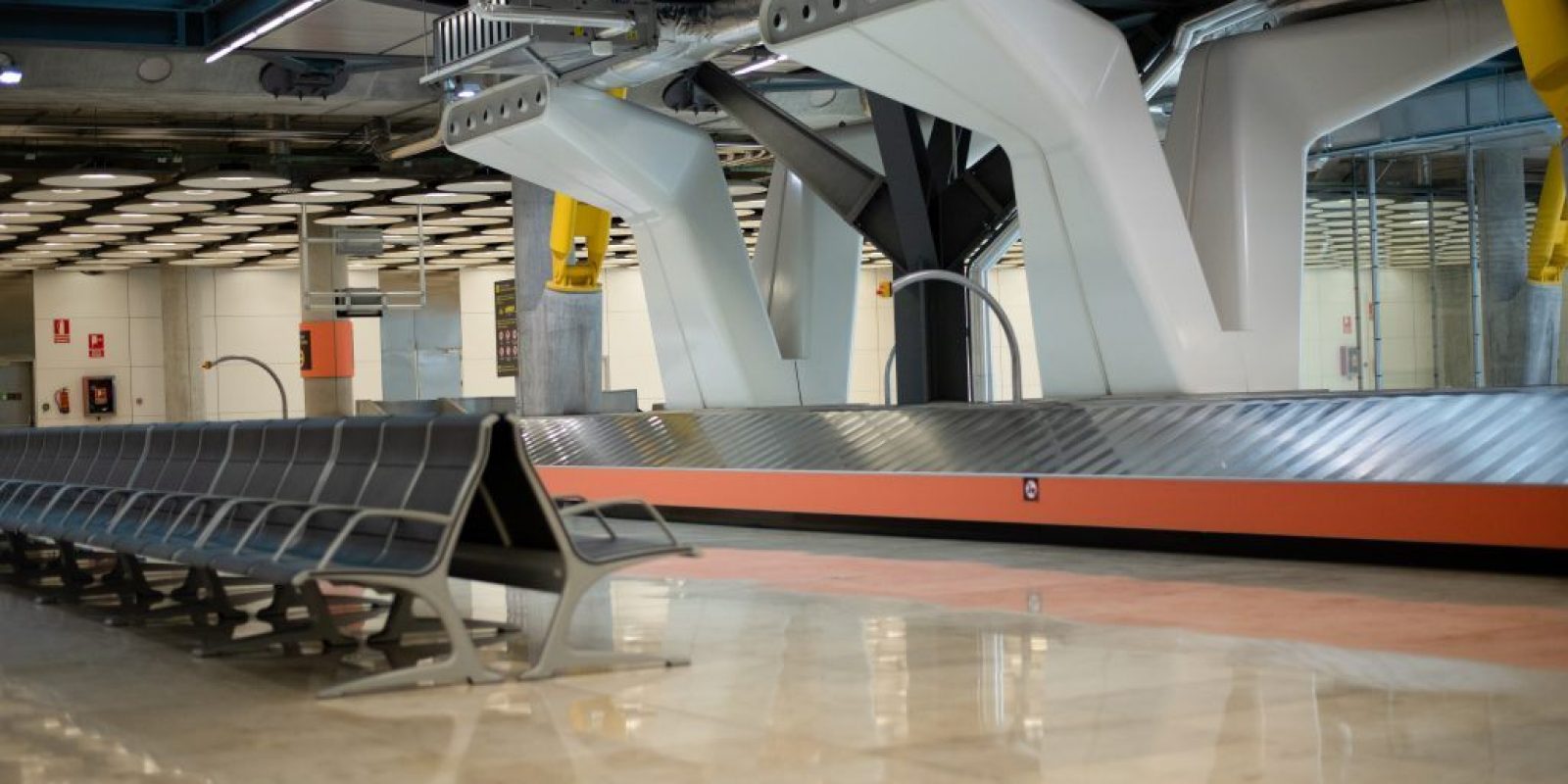 Empty conveyor luggage airport belt and sits
