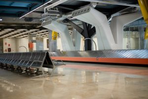 Empty conveyor luggage airport belt and sits