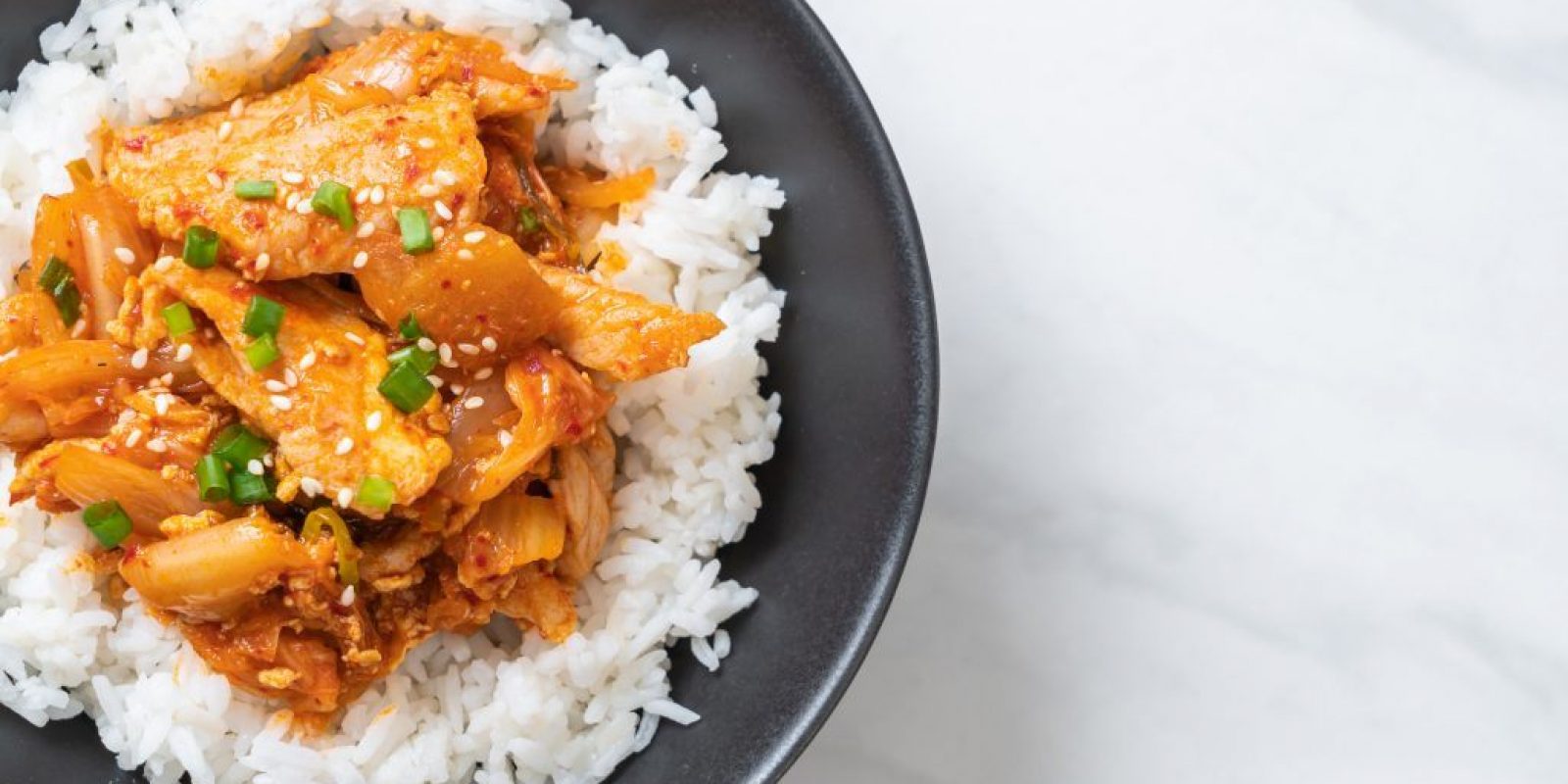 stir-fried pork with kimchi on topped rice